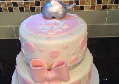Pink And White Elephant Holding A Balloon Cake